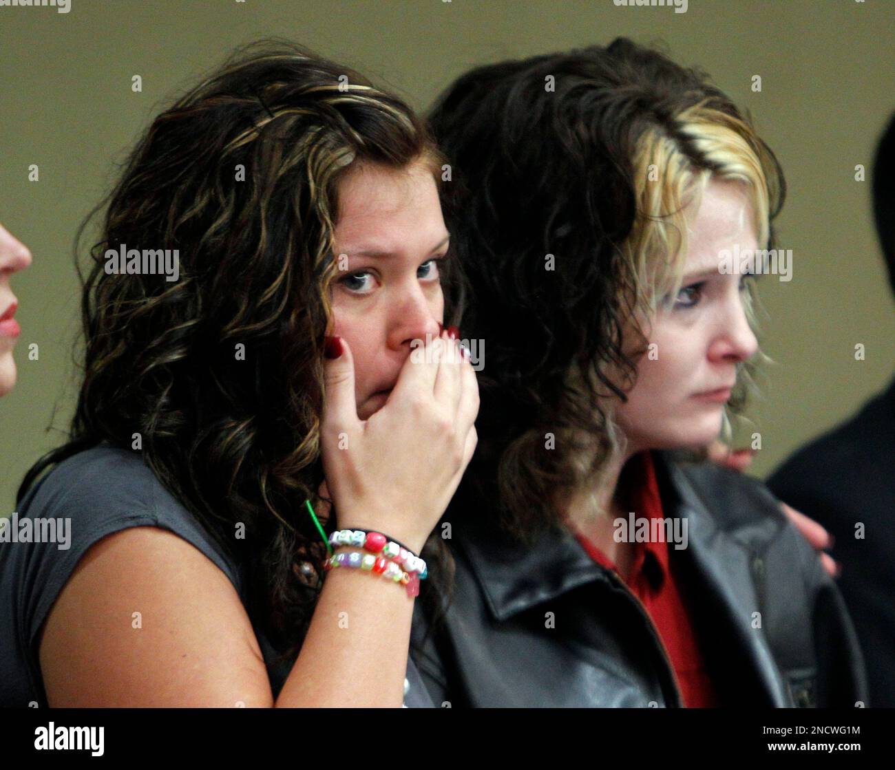 Brittney Starbuck, left, and Amber Fairchild, right, look on during a court appearance for their