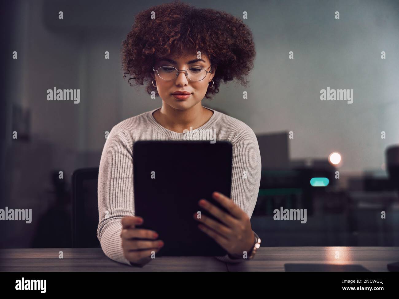 Tablet, programmer and woman in night office, research or programming online in workplace. Information technology, developer and female coder with Stock Photo