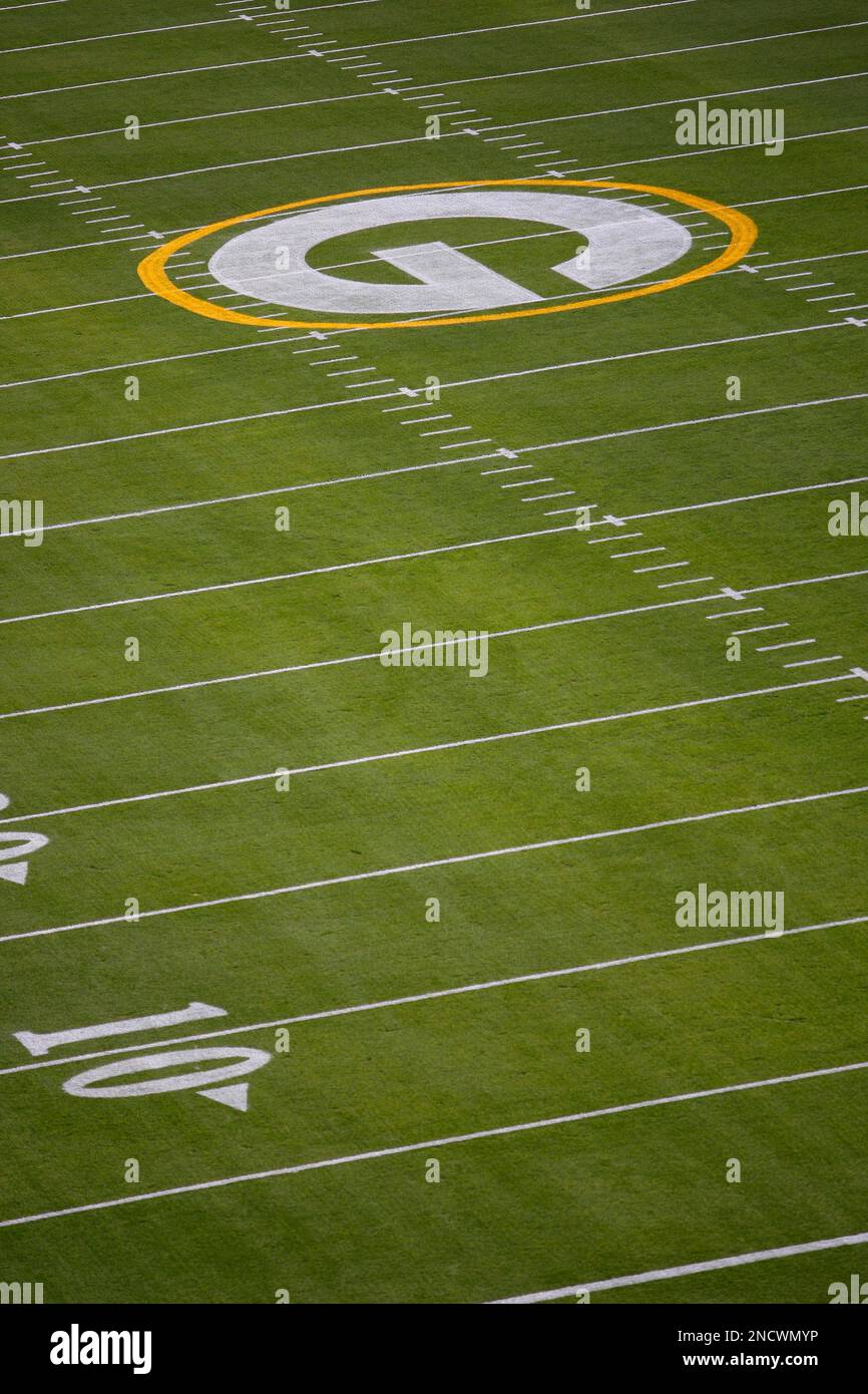 The Green Bay Packers logo is painted on the fifty yard line