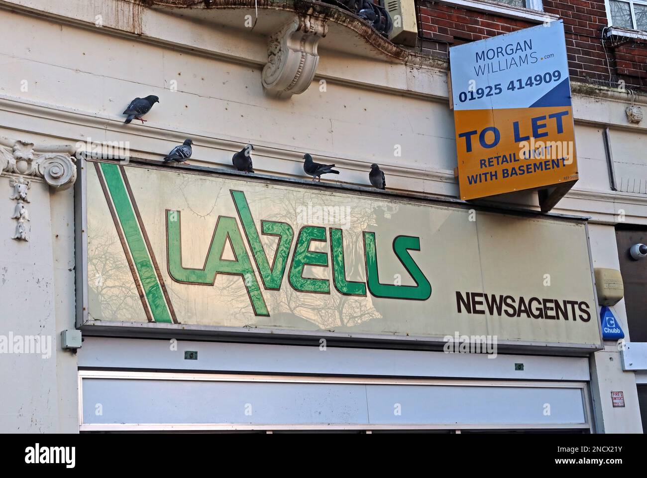 Historic green cubes Lavells Newsagents sign, from 1987,Market Gate Chambers, 4 Buttermarket St, Warrington, Cheshire, England, UK, WA1 2LL Stock Photo