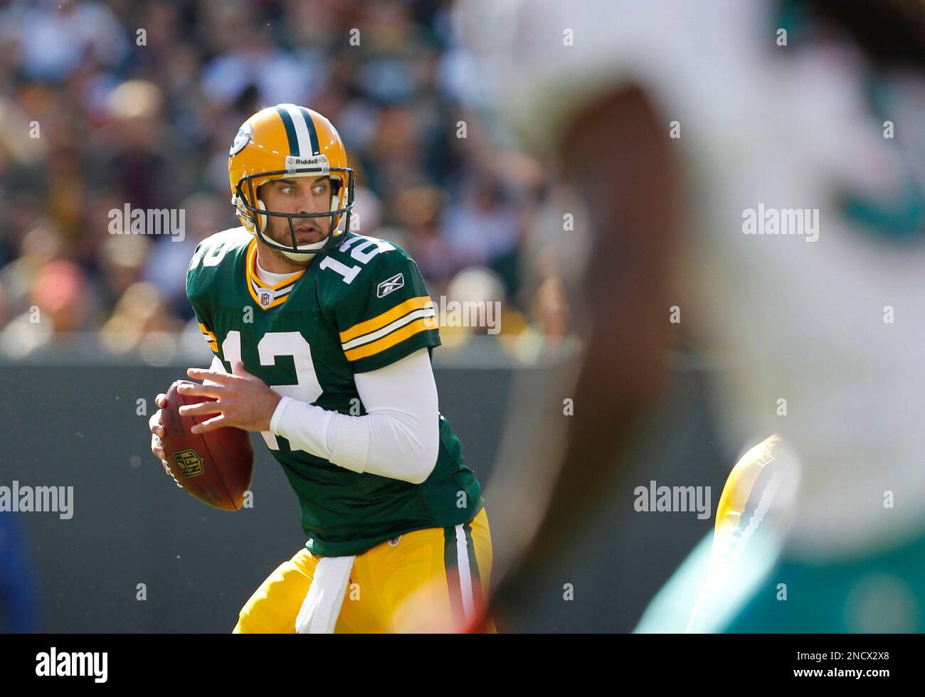 Green Bay Packers quarterback Aaron Rodgers looks to pass against