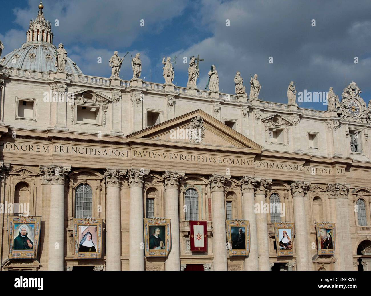 From left, the tapestries of Saint Giulia Salzano, of Italy, Saint Candida  Maria de Jesus Cipitria y Barriola, of Spain, Saint Stanislaw Kazimierczyk  Solys, of Poland, Saint Andre Bessette, of Canada, Saint