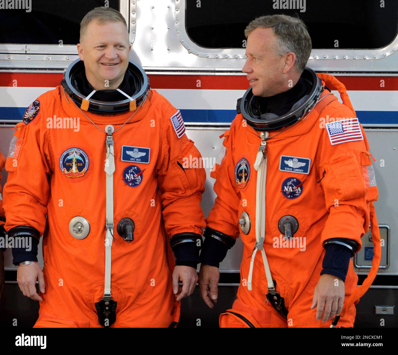 Space shuttle Discovery pilot Eric Boe, left, and commander Steve