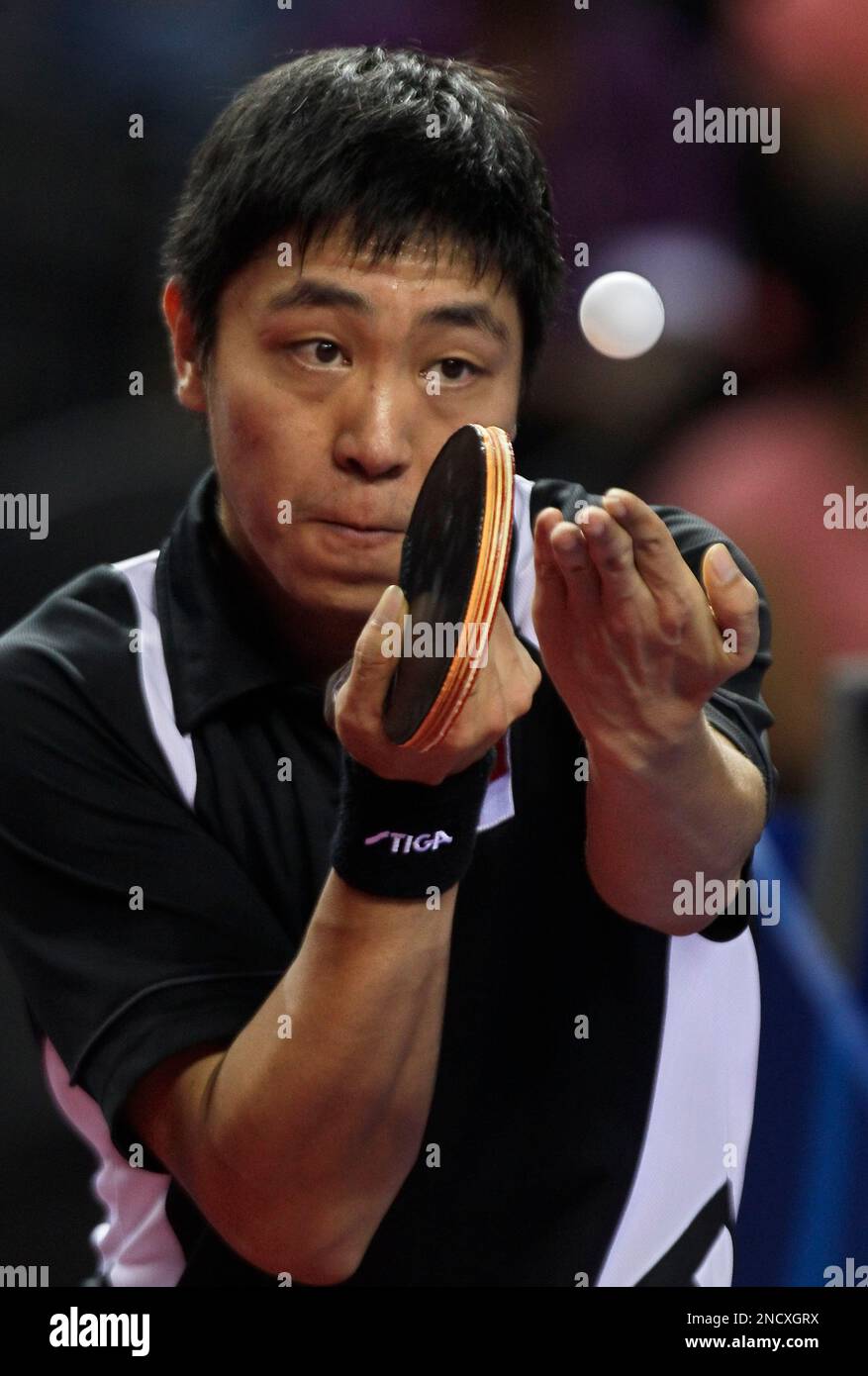Singapore's Gao Ning serves to win the silver medal in the men's table