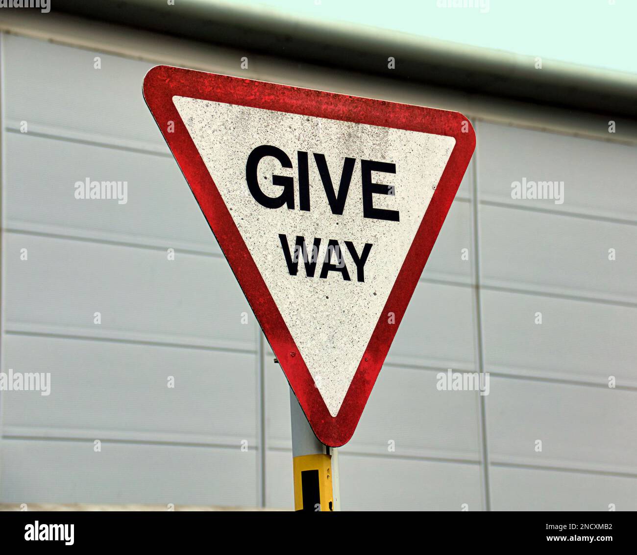 give way sign Stock Photo