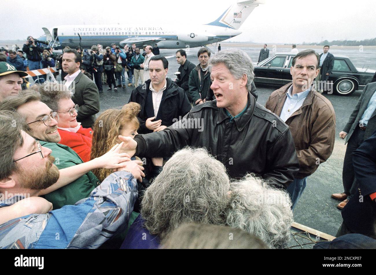 President Bill Clinton greets supporters after arriving at the Hot ...