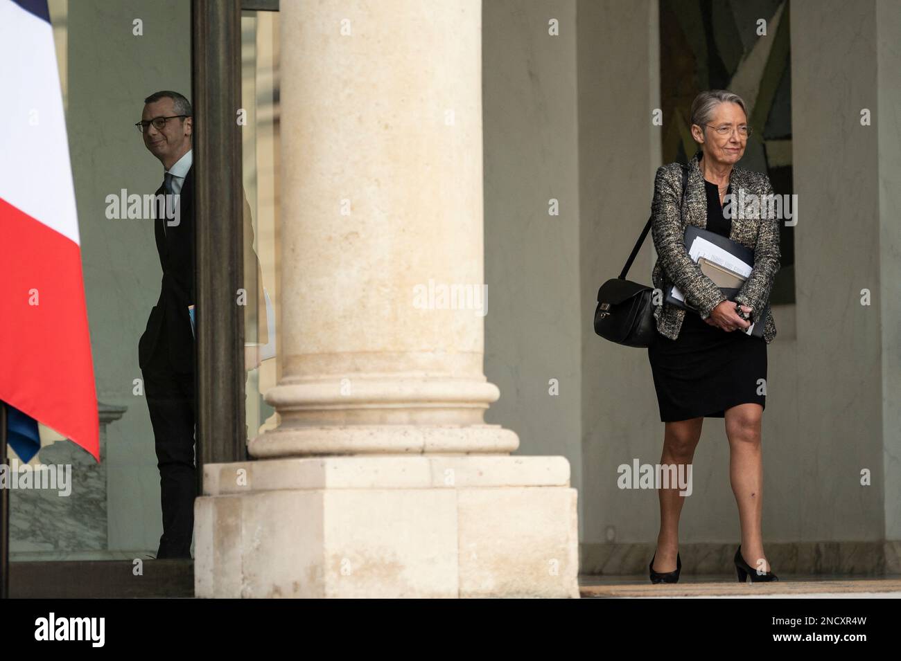 Paris, France February 15, 2023. Elysee Palace General Secretary Alexis  Kohler and French Prime Minister Elisabeth Borne walk after taking part in  the weekly cabinet meeting at The Elysee Presidential Palace in