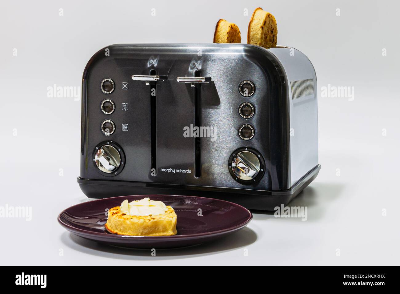 Freshly buttered crumpets from a Morphy Richards toaster Stock Photo Alamy