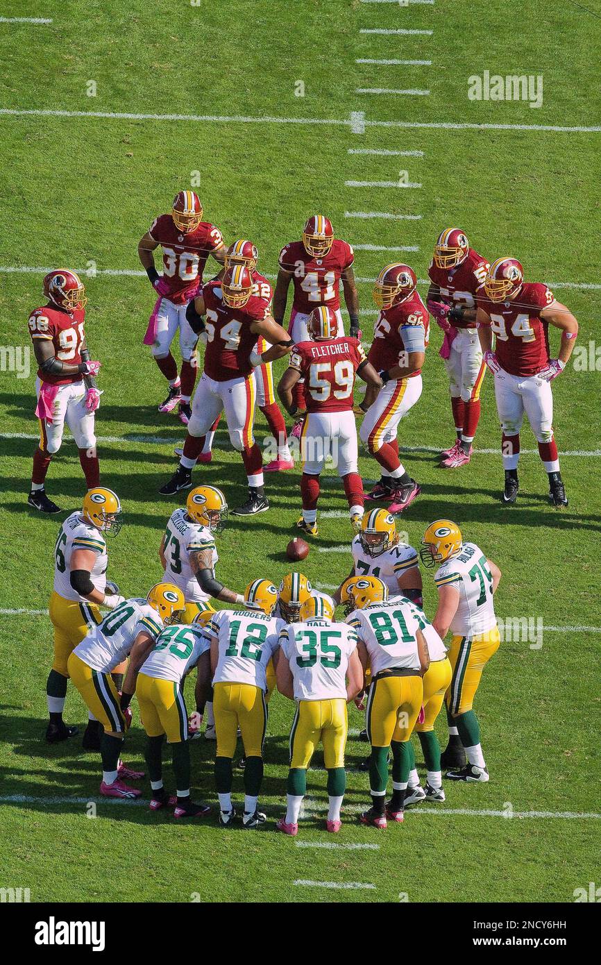 Green Bay Packers players huddle up during an NFL football game against the  Washington Commanders, Sunday, October 23, 2022 in Landover. (AP  Photo/Daniel Kucin Jr Stock Photo - Alamy