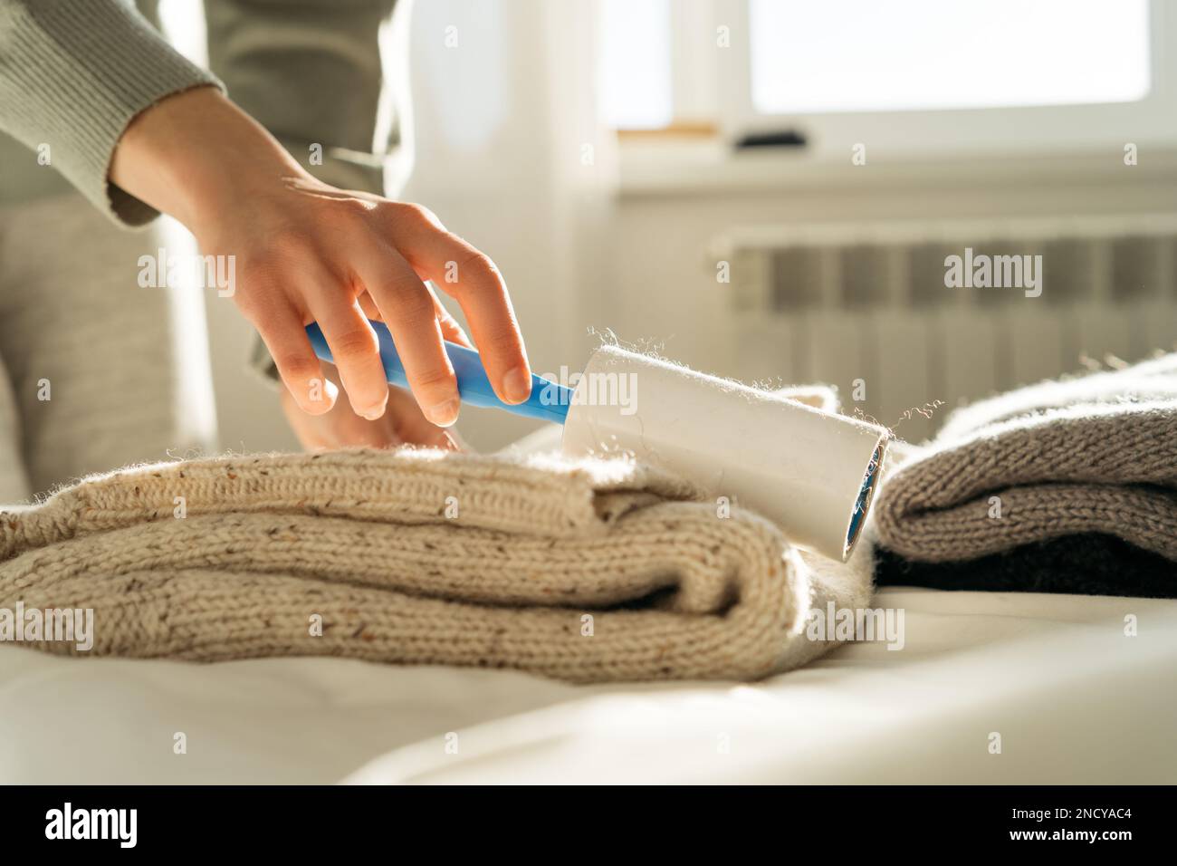 Woman removing clothes hires stock photography and images Alamy