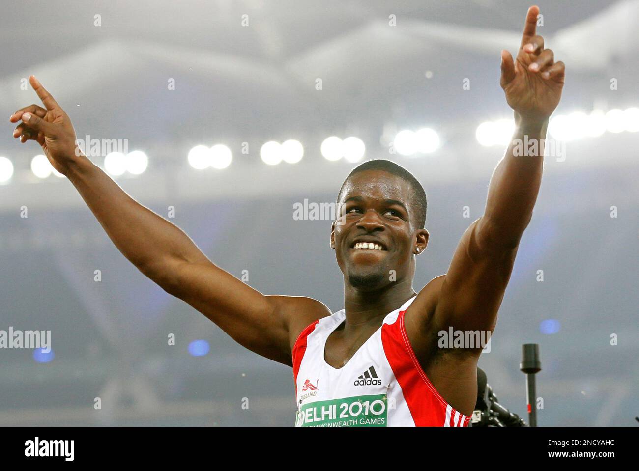 England's Leon Baptiste celebrates winning gold in the Men's 200m final during the Commonwealth Games at the Jawaharlal Nehru Stadium in New Delhi, India, Sunday, Oct. 10, 2010. (AP Photo/Anja Niedringhaus) Stock Photo