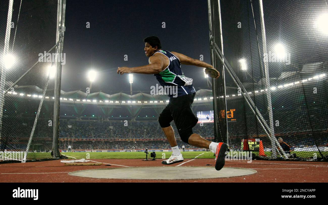 India's Vikas Gowda takes a throw in the Men's Discus final during the ...
