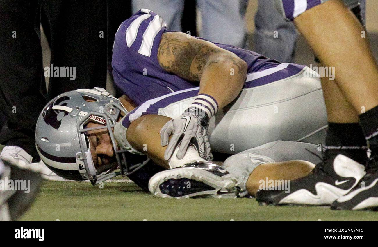 Kansas State wide receiver Brodrick Smith holds his leg after being injured during the fourth quarter of an NCAA college football game against Nebraska on Thursday, Oct. 7, 2010 in Manhattan, Kan.