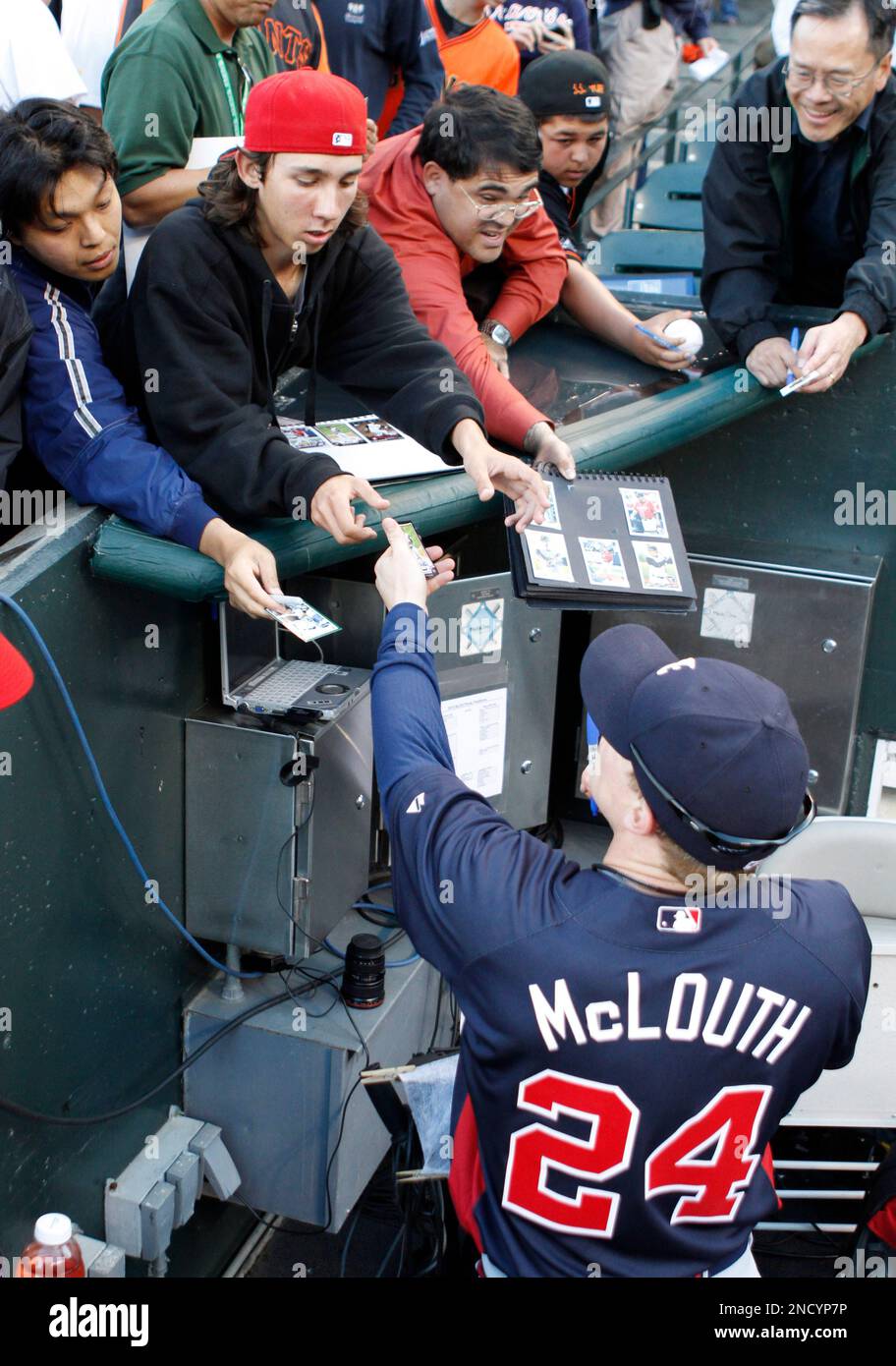 Atlanta Braves center fielder Nate McLouth signs autographs before Game