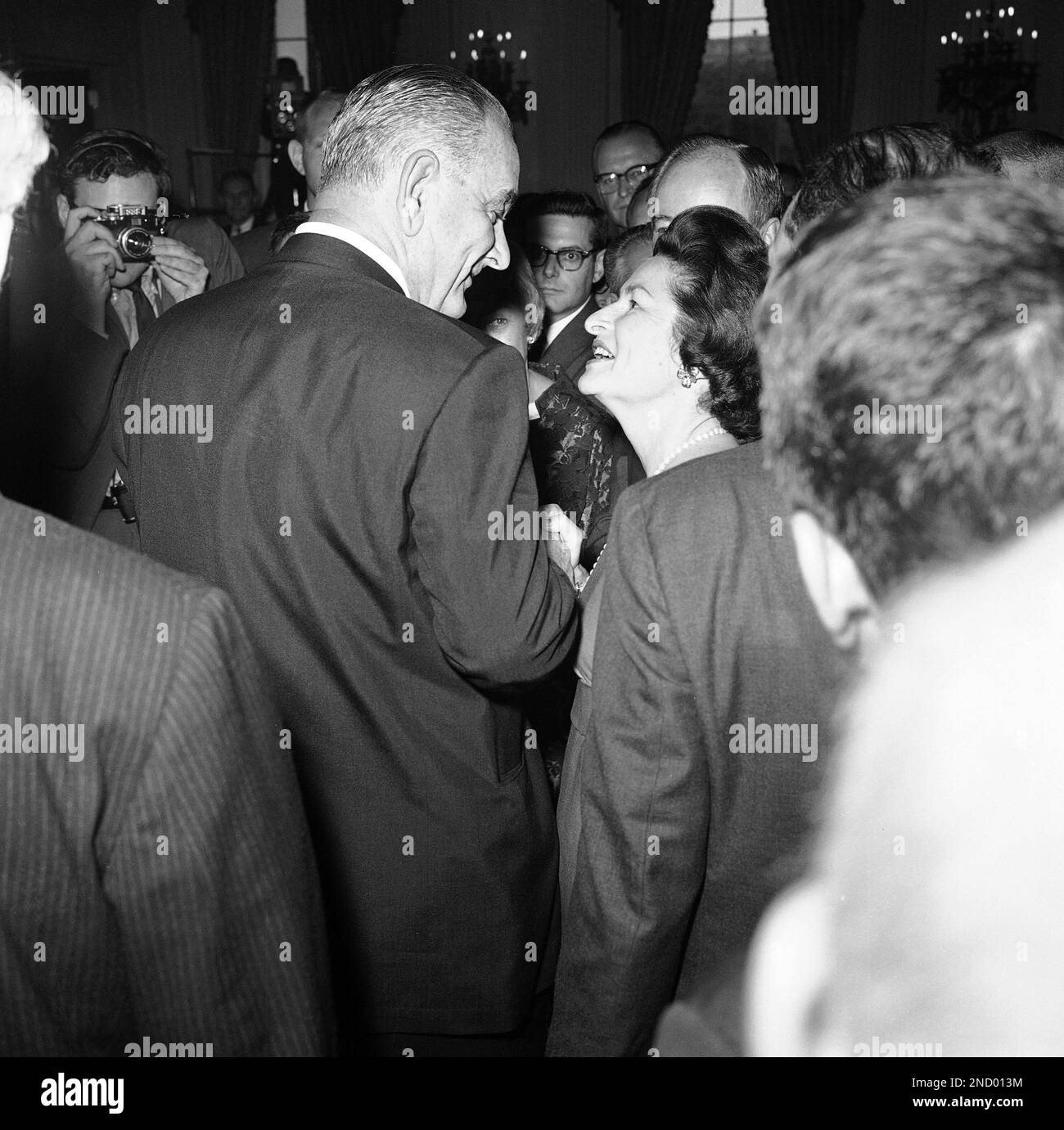 President Lyndon and Mrs. Lady Bird Johnson looking at each other in