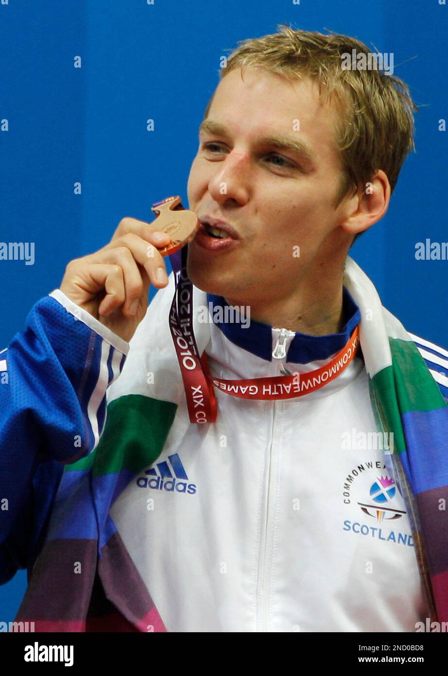 Scotland's David Carry poses with his bronze medal for the Men's 400m