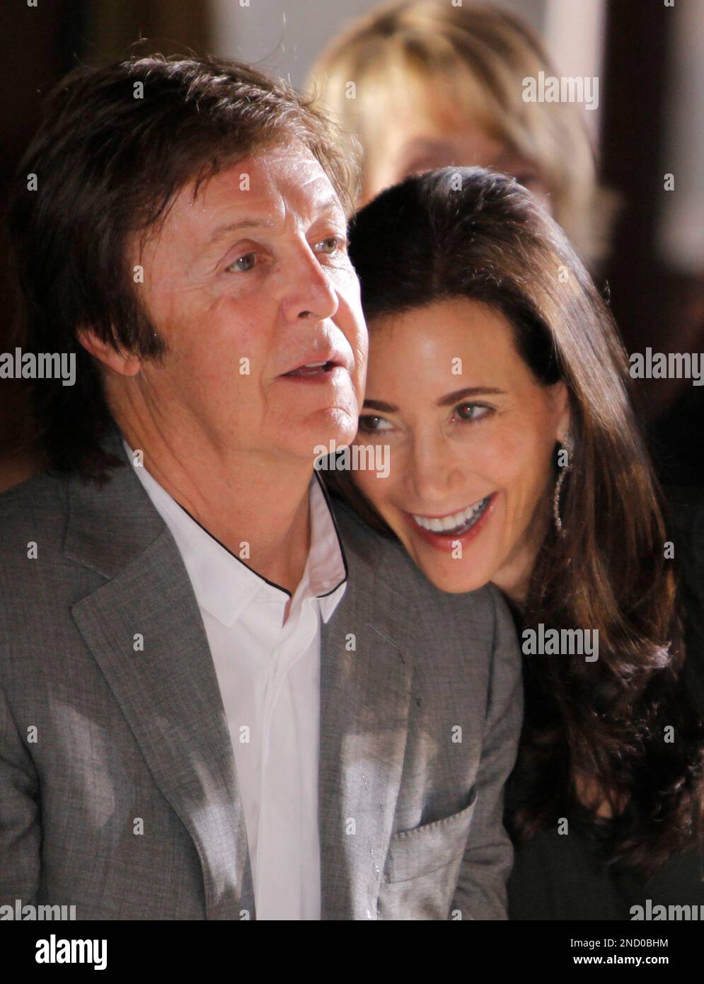 British musician Paul McCartney and his girlfriend Nancy Shevell watch Stella McCartney's spring-summer 2011 ready to wear fashion collection show, presented in Paris, Monday, Oct. 4, 2010. (AP Photo/Thibault Camus) Stock Photo