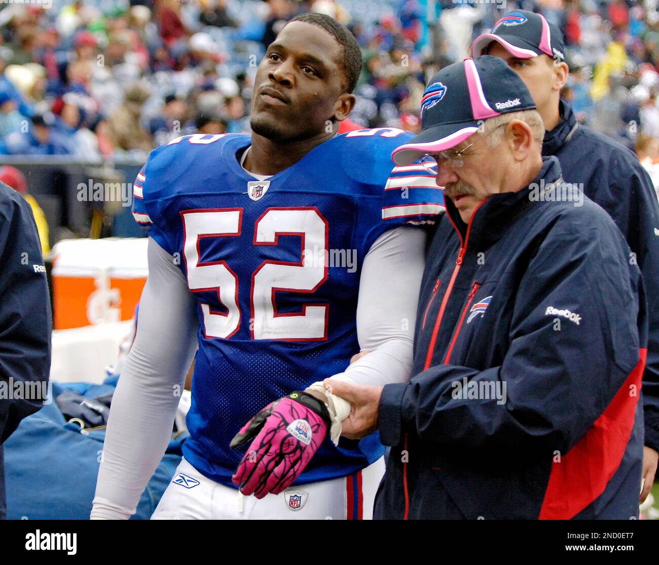 Buffalo Bills linebacker Arthur Moats is walked off the field with a
