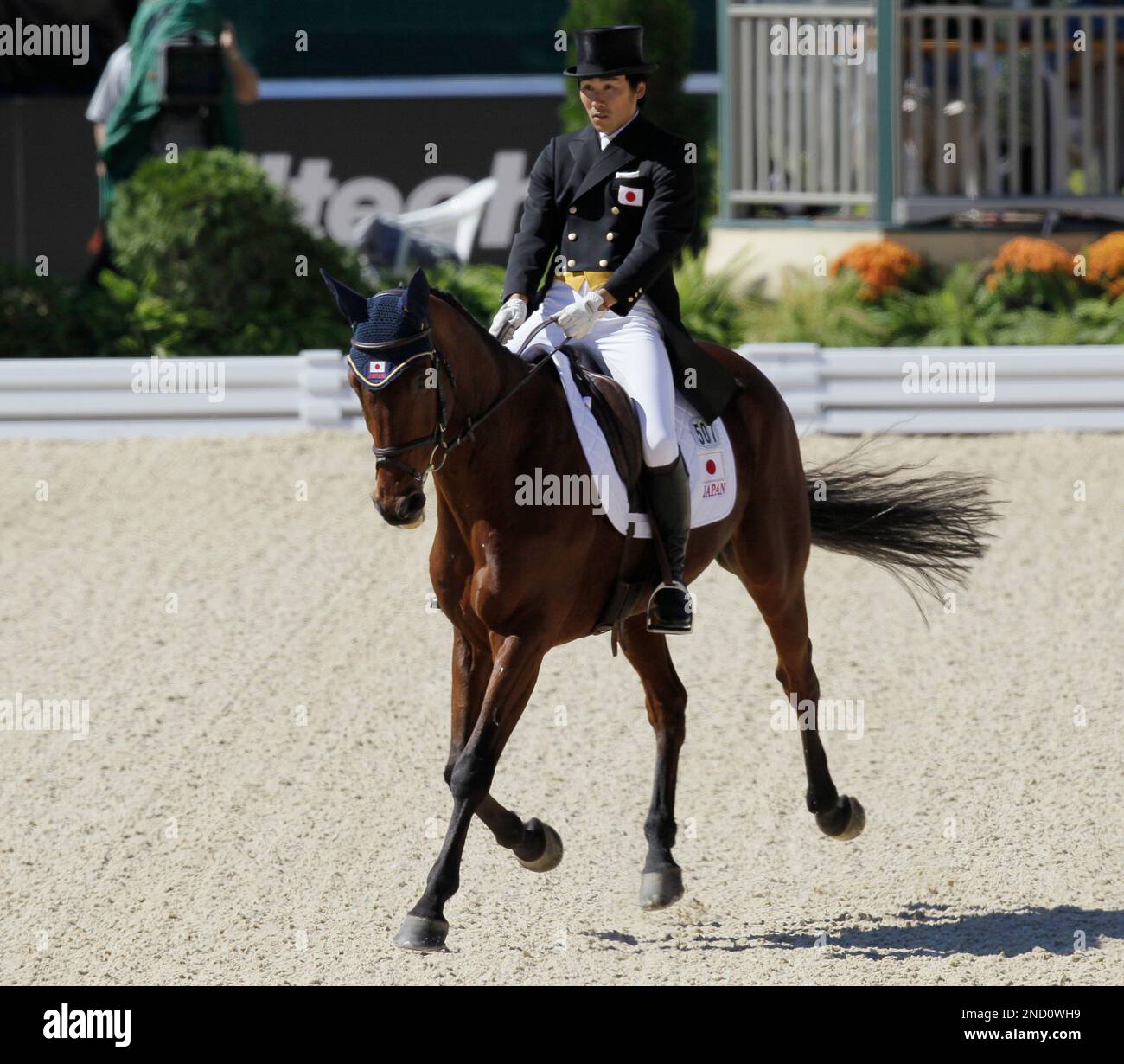 Yoshiaki Oiwa from Japan rides Khanjer Black during the dressage