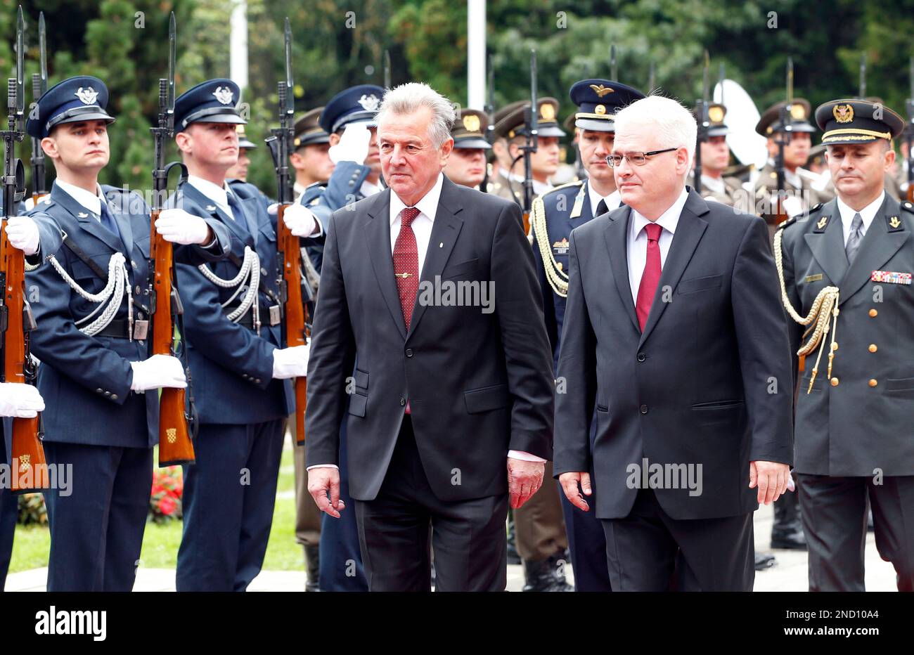 Hungary's president Pal Schmitt, left, and his Croatian counterpart Ivo Josipovic review guards of honor during an arrival ceremony in Zagreb, Croatia, Friday, Oct. 1, 2010. President Schmitt is on a single day official visit to Croatia. (AP Photo/Darko Bandic) Stock Photo