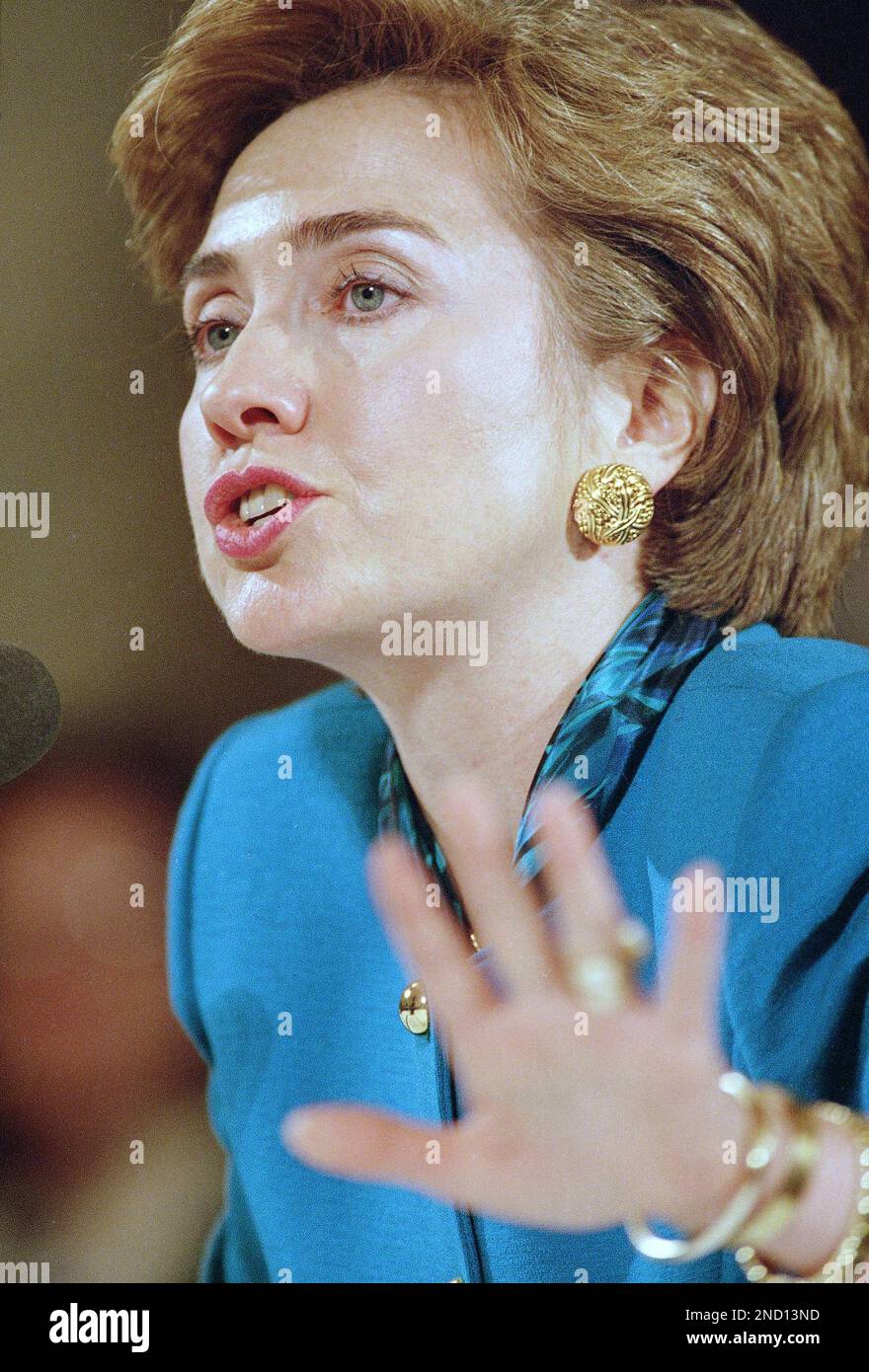 First lady Hillary Rodham Clinton gestures while testifying on Capitol Hill in Washington on Wednesday, Sept. 29, 1993, before the Senate Labor Committee which was holding hearings on health care reform. Mrs. Clinton told the committee that the Clinton Administration health plan will make American workers both more secure and productive and ease families’ fears that “the future is closing in on them”. (AP Photo/Doug Mills) Stock Photo