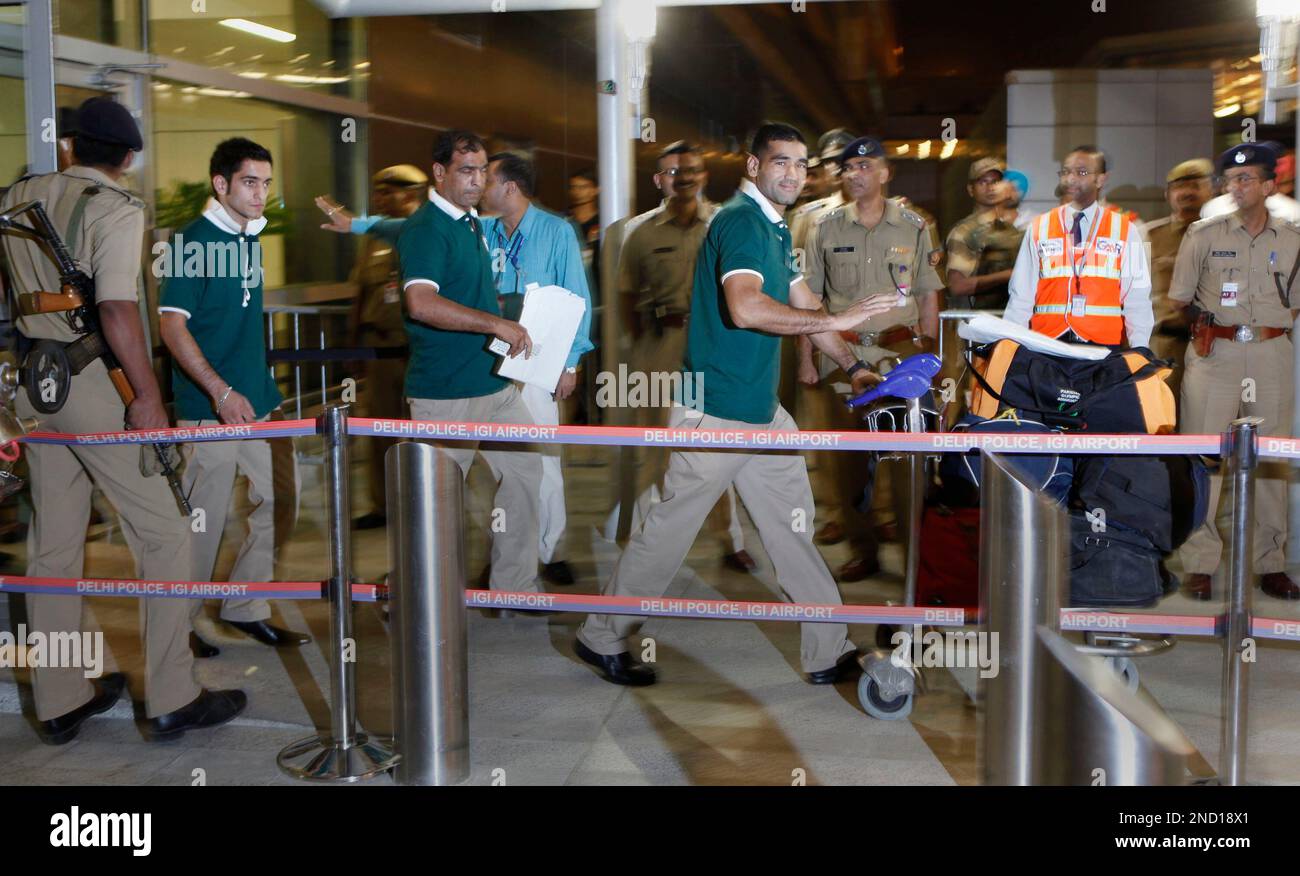 Pakistan team members for the Commonwealth Games arrive at the Indira Gandhi International airport in New Delhi, India, Wednesday, Sept. 29, 2010. The games are scheduled to open Sunday. (AP Photo/Anupam Nath) Stock Photo