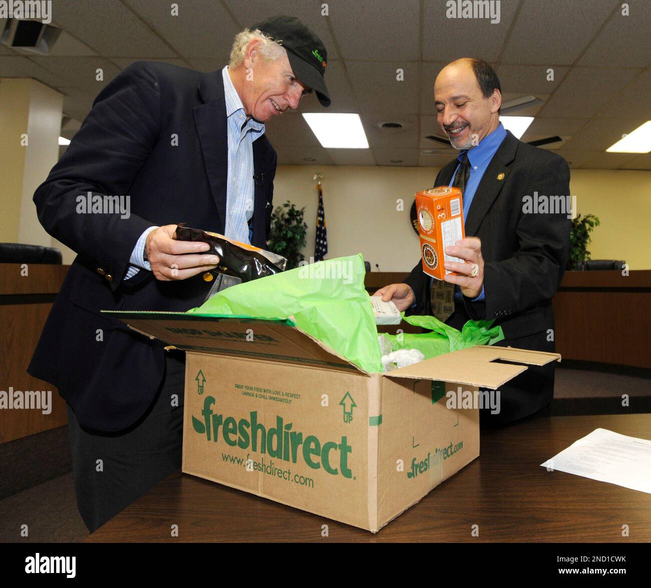 FreshDirect CEO Rick Braddock, left delivers groceries to Montclair