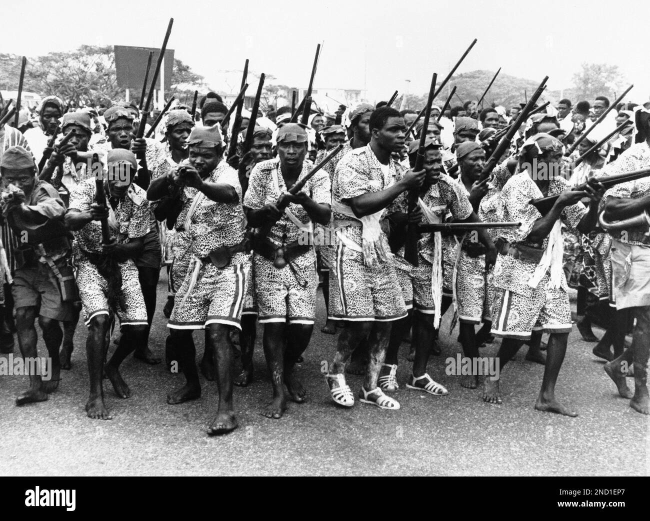 Dressed in colorful uniforms with a leopardskin pattern, Africans
