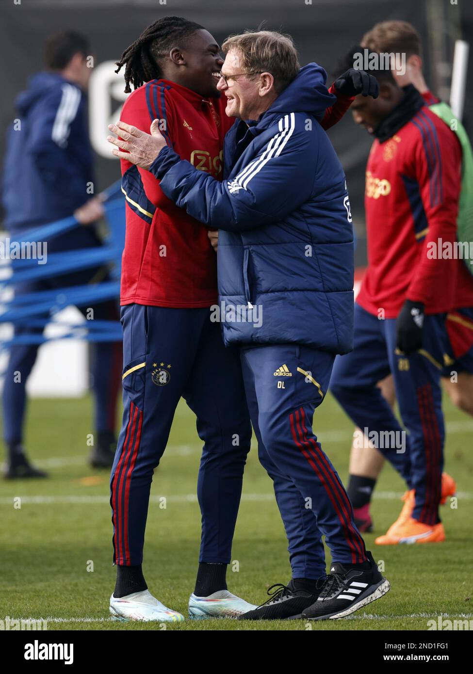AMSTERDAM - (lr) Calvin Bassey, Ajax assistant coach Dwight Lodeweges during a training session prior to the UEFA Europa League play-off match between Ajax Amsterdam and FC Union Berlin at sportpark de Toekomst on February 15, 2023 in Amsterdam, Netherlands. ANP MAURICE VAN STONE Stock Photo