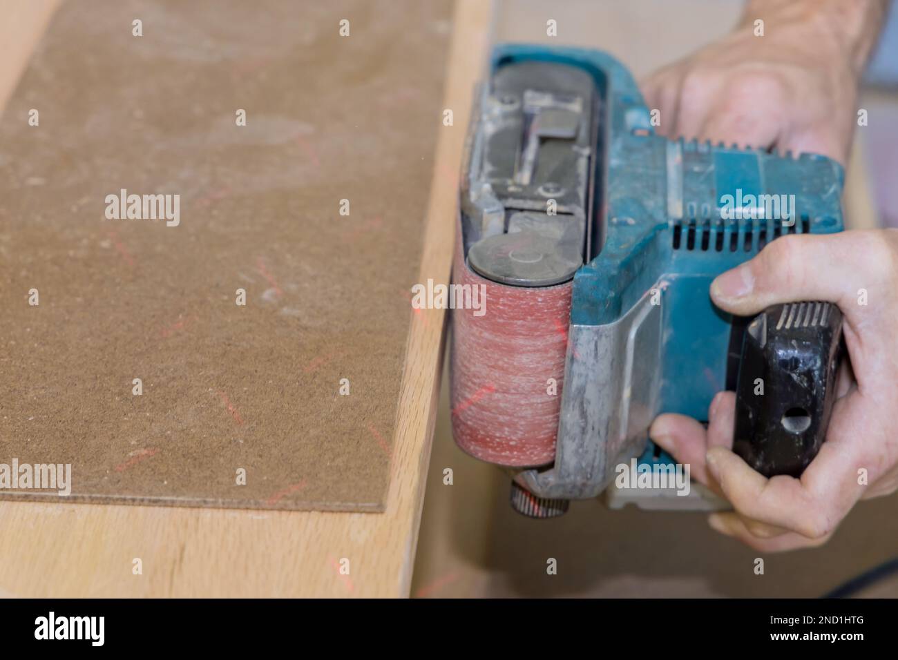 In carpenter works process of building new house grinding the wooden