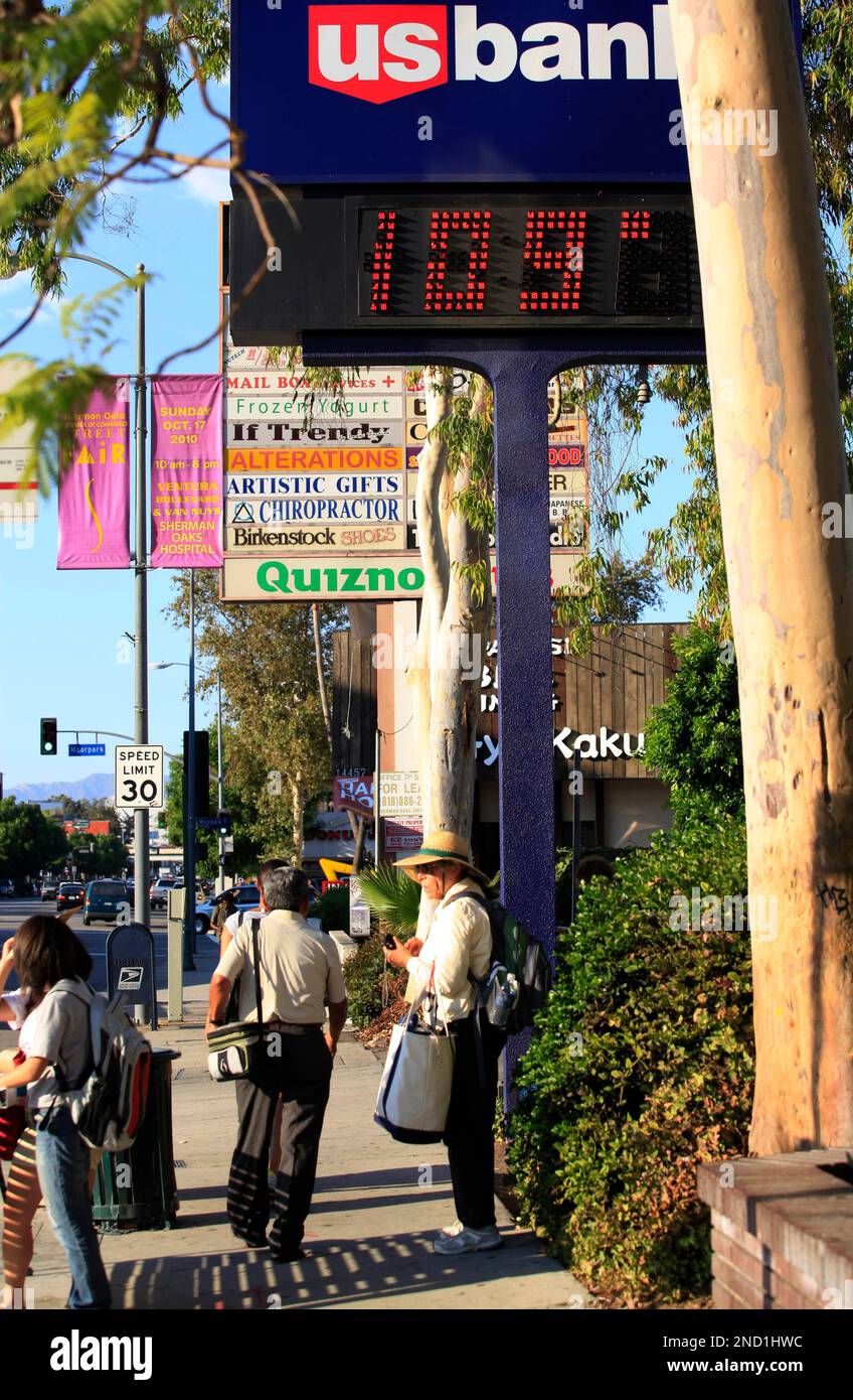 A digital bank sign shows a temperature of 109 degrees in the Sherman