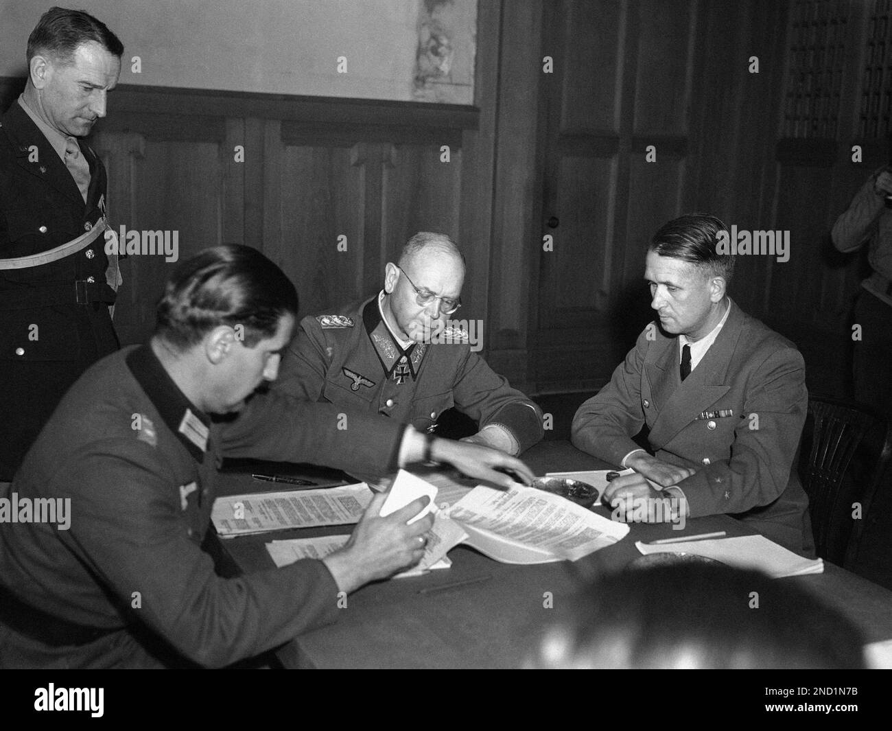 On the left, Erich Brandenberger, General of the 8th Panzer Division of the  LVI Armeekorps within Panzer Group 4, which was subordinate to the Army  Group North and is deployed here in