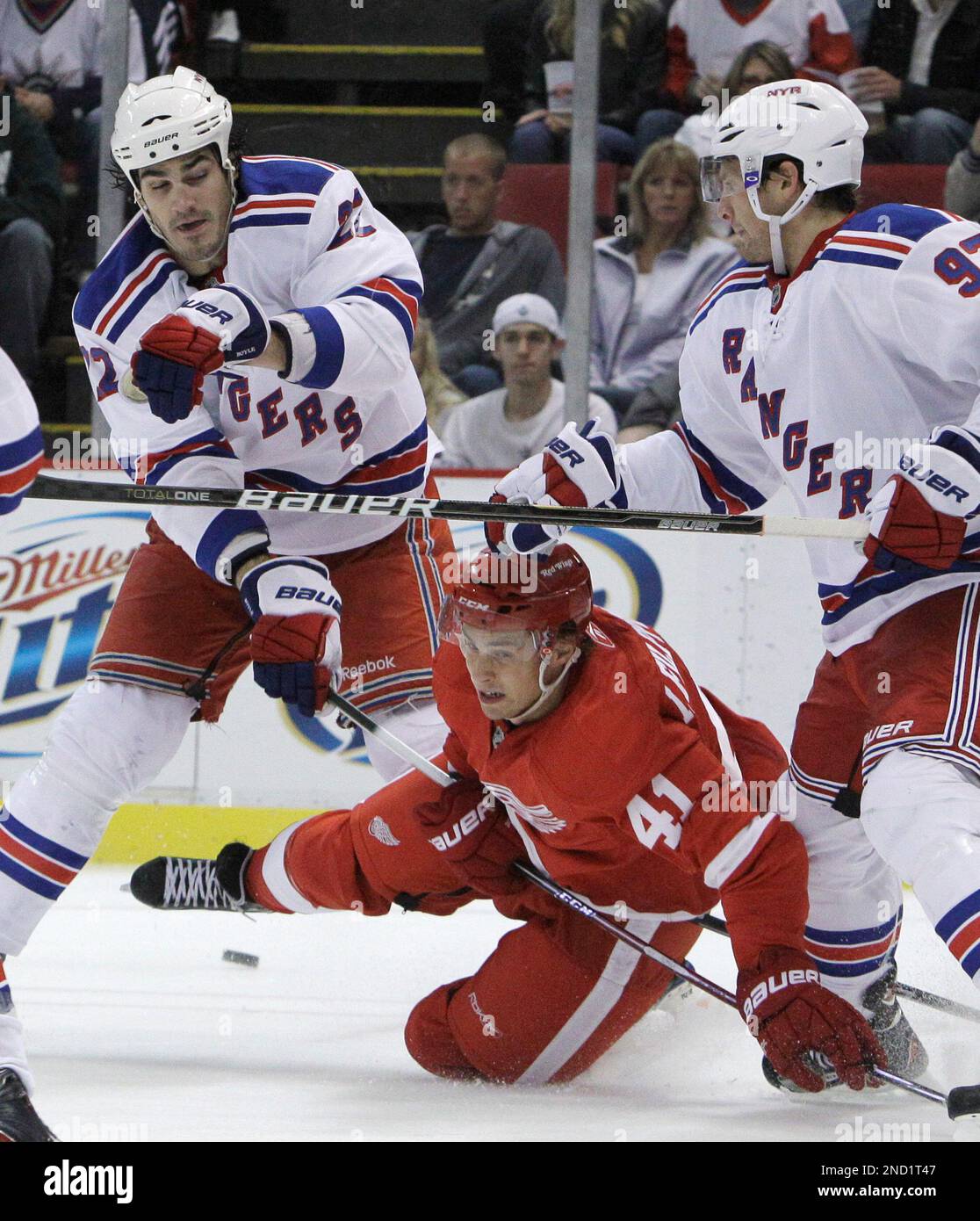 Detroit Red Wings winger Iliari Filppula (41) falls between New York  Rangers center Brian Boyle (22) and defenseman Matt Gilroy (97) during the  third period of an NHL preseason hockey game in