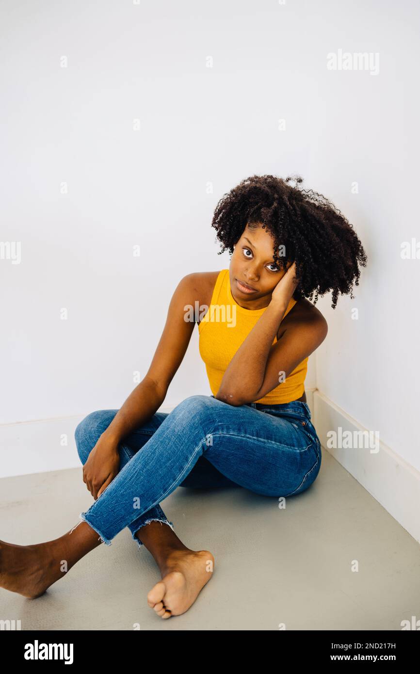 Full body of pensive barefoot young African American female in
