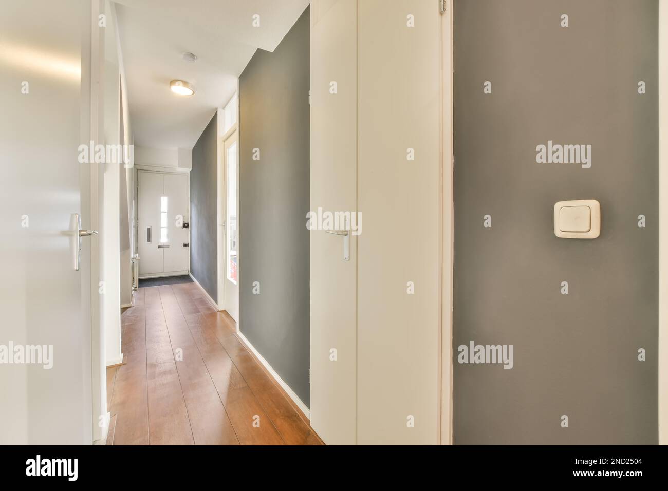 Interior design of narrow hallway with white gray walls Stock Photo Alamy