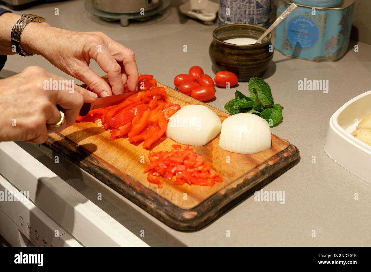 Vegetable Stir Fry Preparation on wooden chopping board with Red
