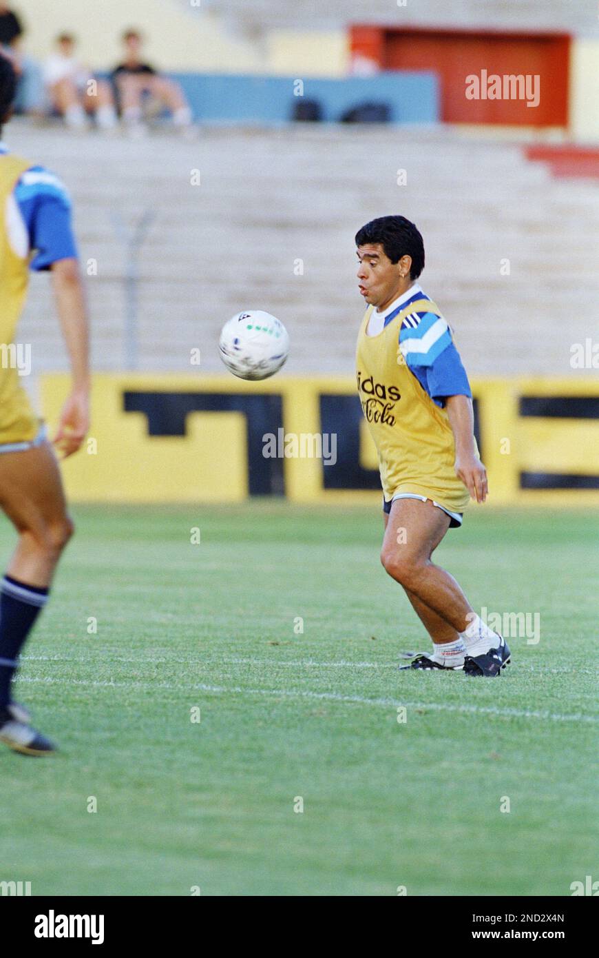 Argentinian soccer star Diego Maradona concentrates on receiving an  incoming ball during the Argentinian national team practice held in Ramat  Gan Stadium Sunday, May 29, 1994. The Argentinian team customarily plays the, image size:870x1390