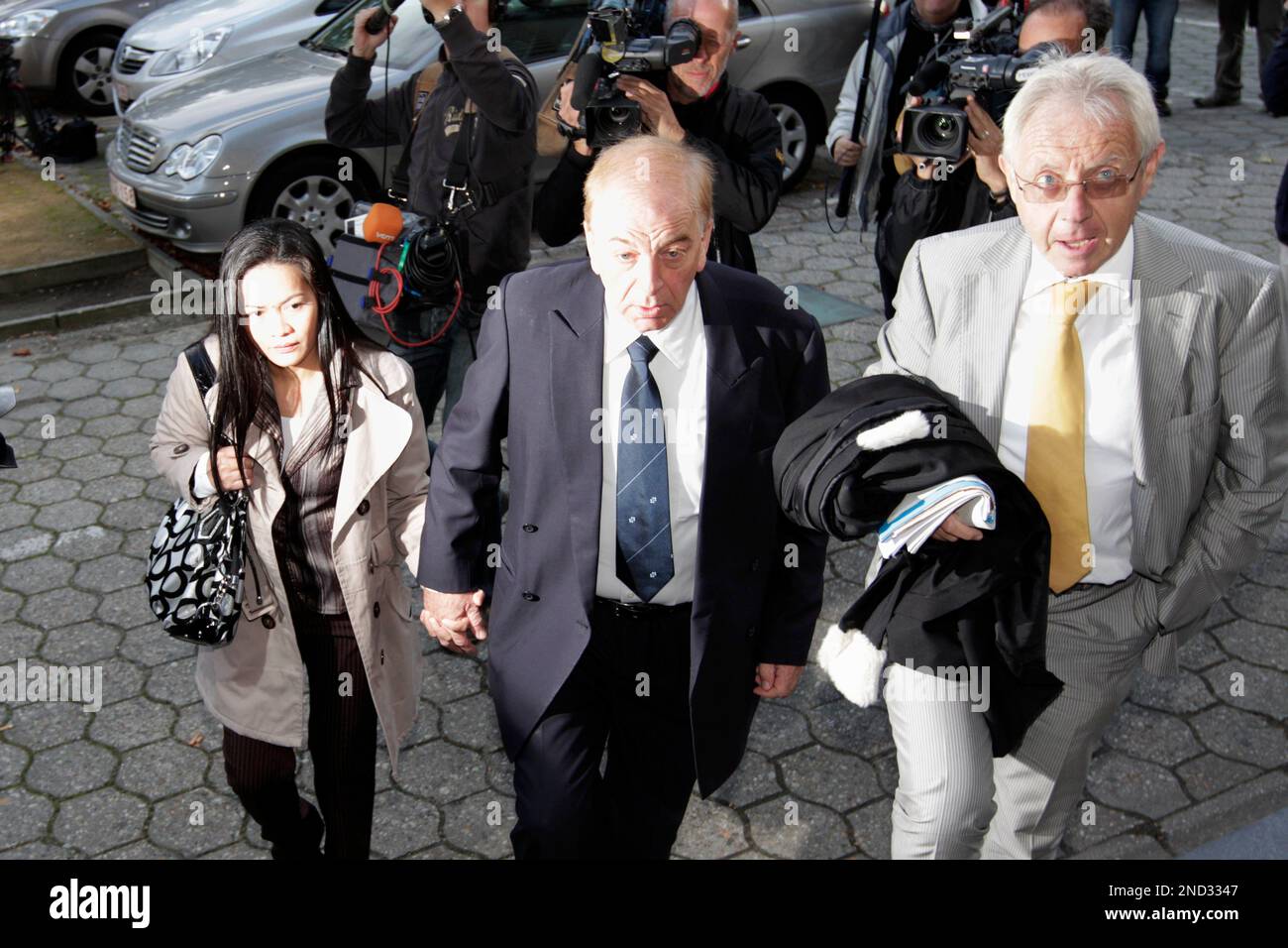 Former Lernout & Hauspie CEO Jo Lernout, center, arrives with his lawyer Luc Gheysens, right, at the court house in Ghent, Belgium, Monday, Sept. 20, 2010. The verdict is due in Belgium's largest fraud trial, former speech technology company Lernout & Hauspie. (AP Photo/Yves Logghe) Stock Photo