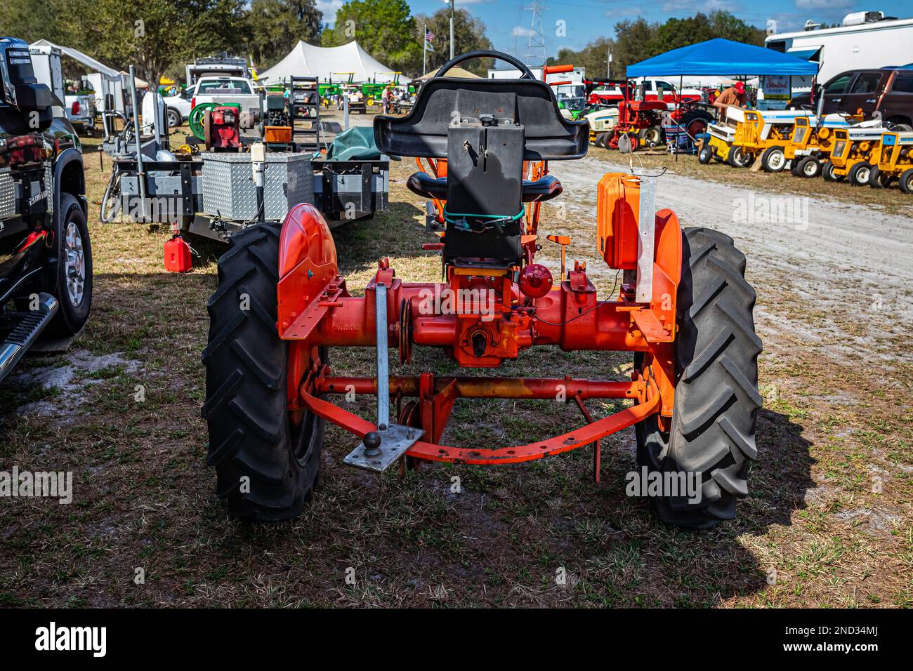 Fort Meade, FL - February 24, 2022: High perspective rear view of a 1948 Allis Chalmers Model C Farm Tractor at a local tractor show. Stock Photo