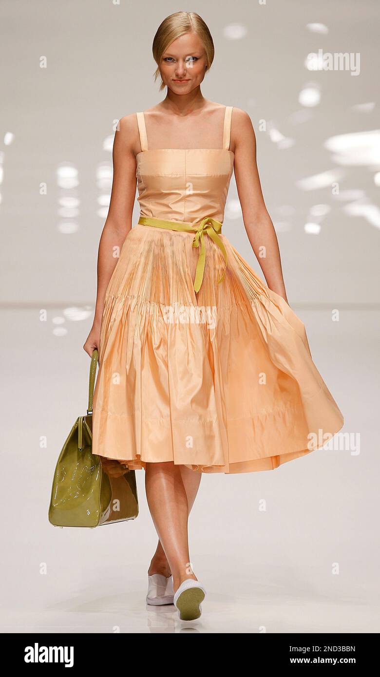 jasper conran orange dress A model presents an outfit by designer Jasper Conran, at London Fashion  Week, in London, Sunday, Sept. 19, 2010. The designers are showing their  Spring/Summer 2011 collections. (AP Photo/Alastair Grant Stock Photo -
