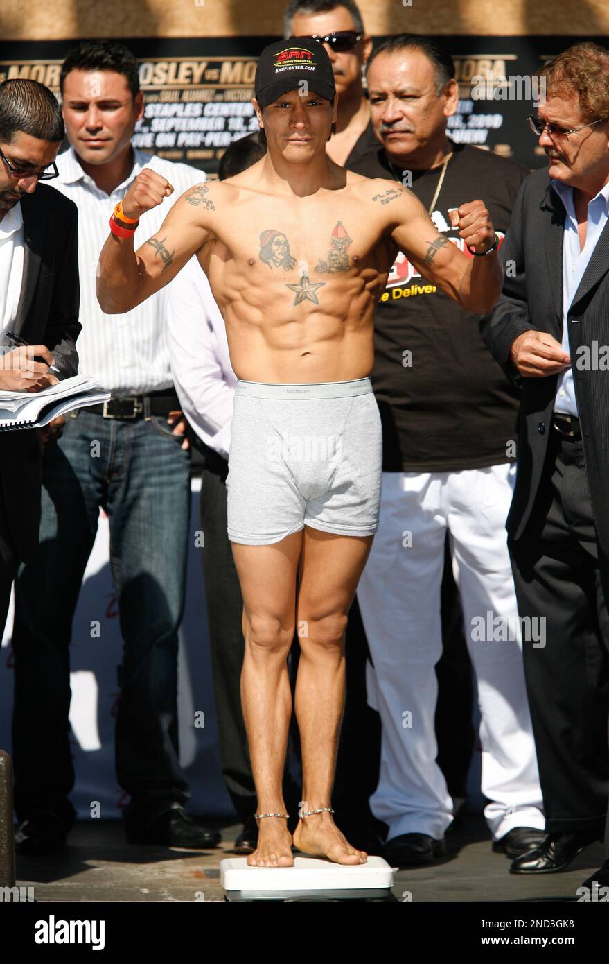 Boxer Daniel Ponce de Leon of Mexico stands on a scale at a weigh in