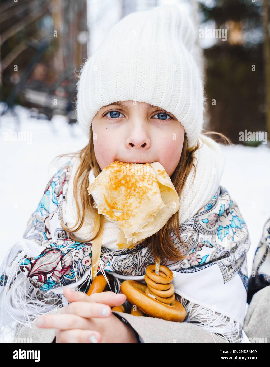 Russian national festival Maslenitsa, shrovetide. Little cute beautiful