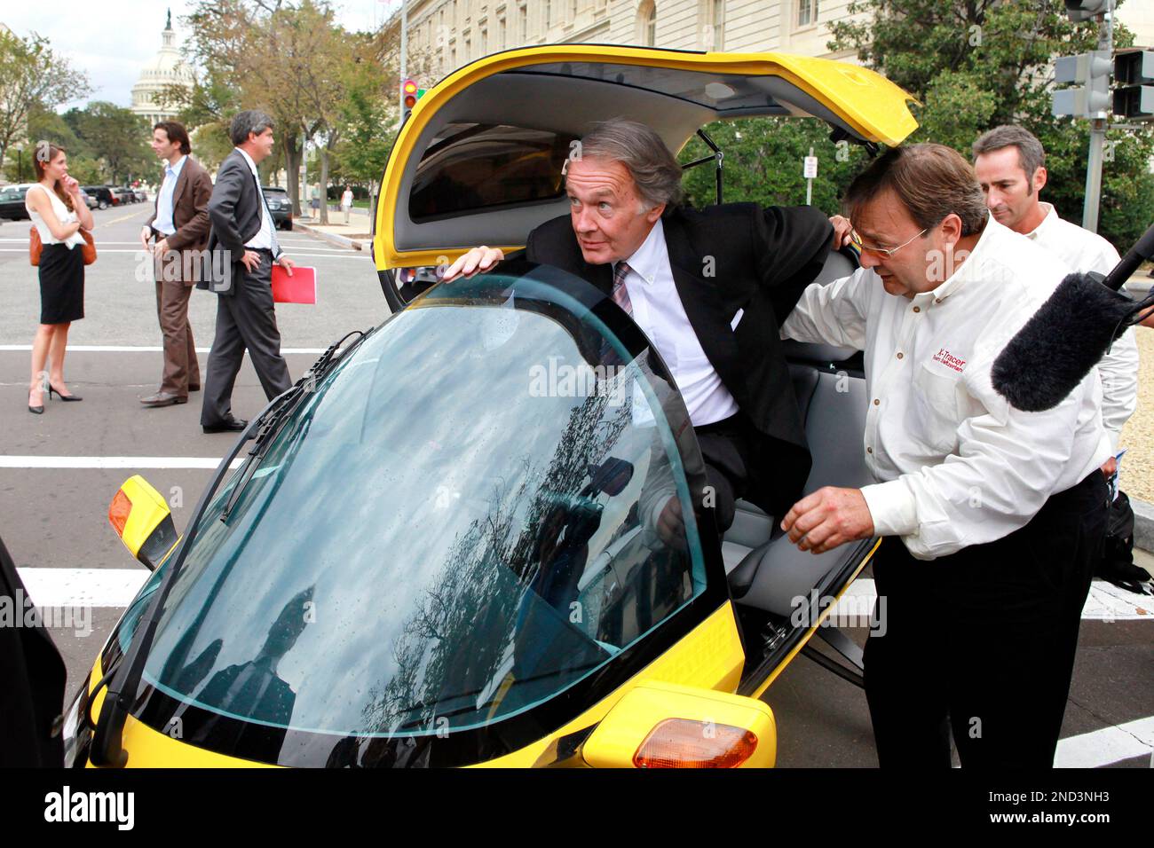Rep. Edward Markey, DMass. exits a tandem twoseater electric vehicle