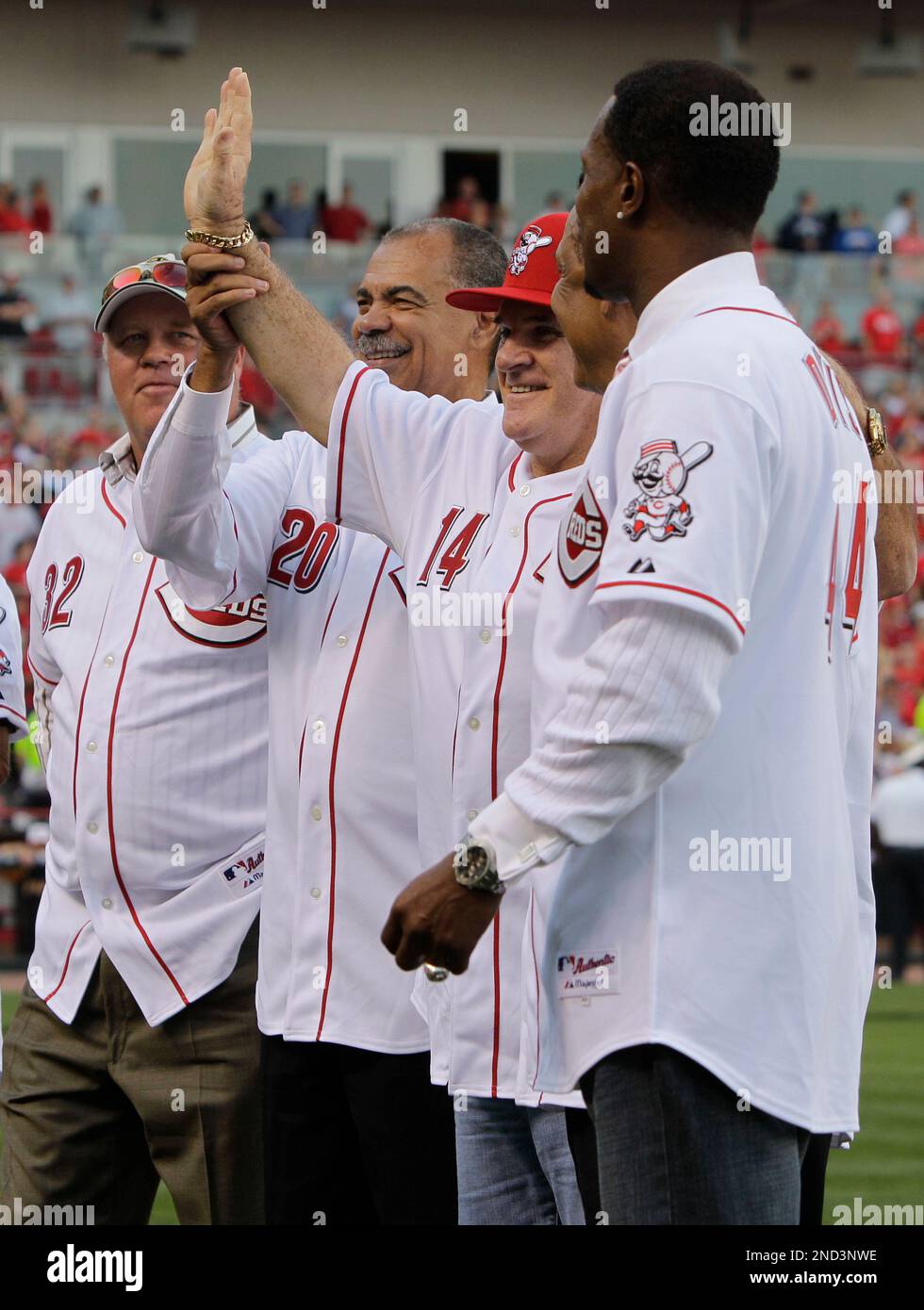 Former Cincinnati Reds great Pete Rose (14) meets with former teammates,  left to right, Tom Browning, Cesar Geronimo, Tony Perez, and Eric Davis,  during ceremonies celebrating the 25th anniversary of Rose breaking