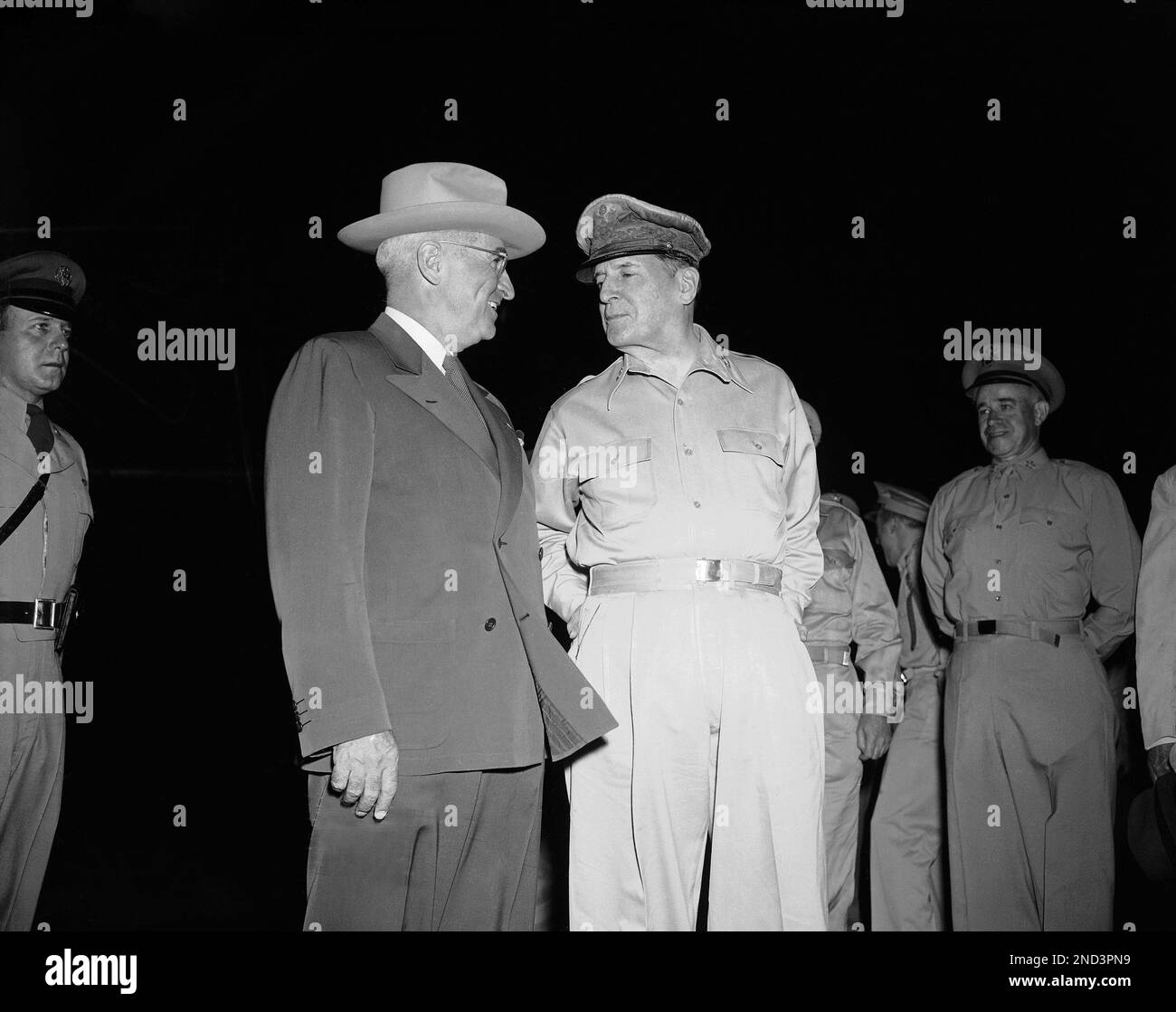 a-smiling-president-harry-truman-is-greeted-by-gen-douglas-macarthur