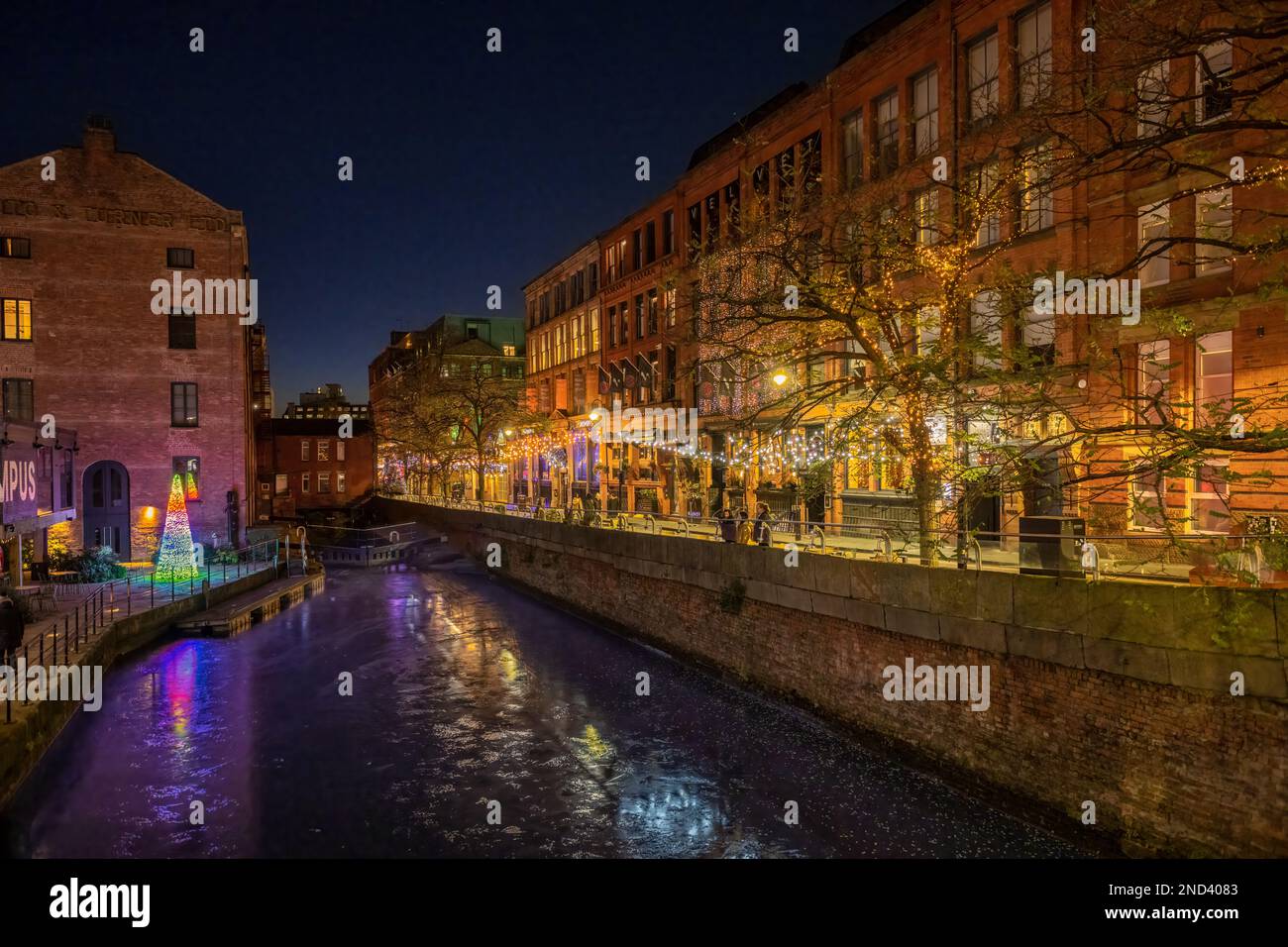 Canal Street and the frozen Rochdale canal at night, at Christmas. Seen from Minshull Street bridge. Manchester. UK Stock Photo