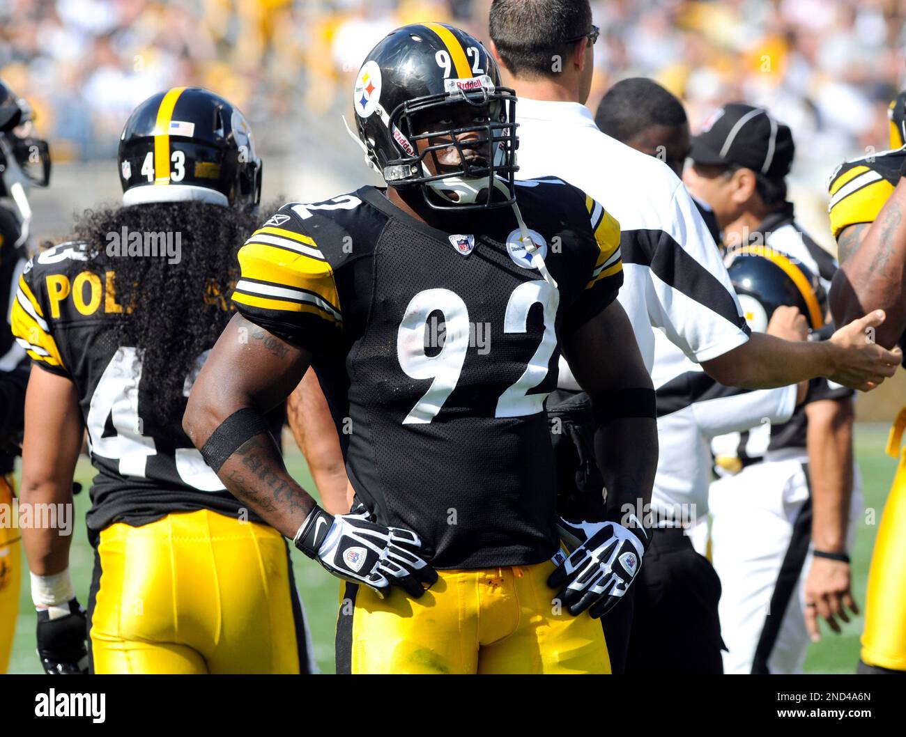 Pittsburgh Steelers linebacker James Harrison scores over Arizona Cardinals  wide receiver Larry Fitzgerald and Steve Breaston (15) on a Super Bowl  record 100-yard interception returned for a touchdown during the second  quarterat