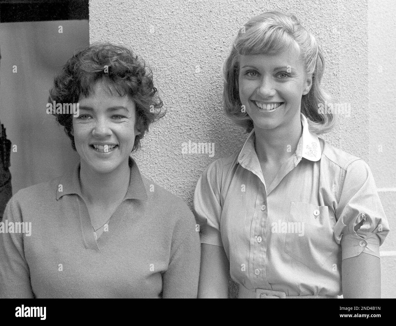 Actresses and co-stars Stockard Channing, left, and Olivia Newton-John ready themselves for their roles in the movie version of "Grease," in Los Angeles, Aug. 30, 1977. Ms. Channing and Ms. Newton-John star with John Travolta in the film. (AP Photo/Nick Ut) Stock Photo