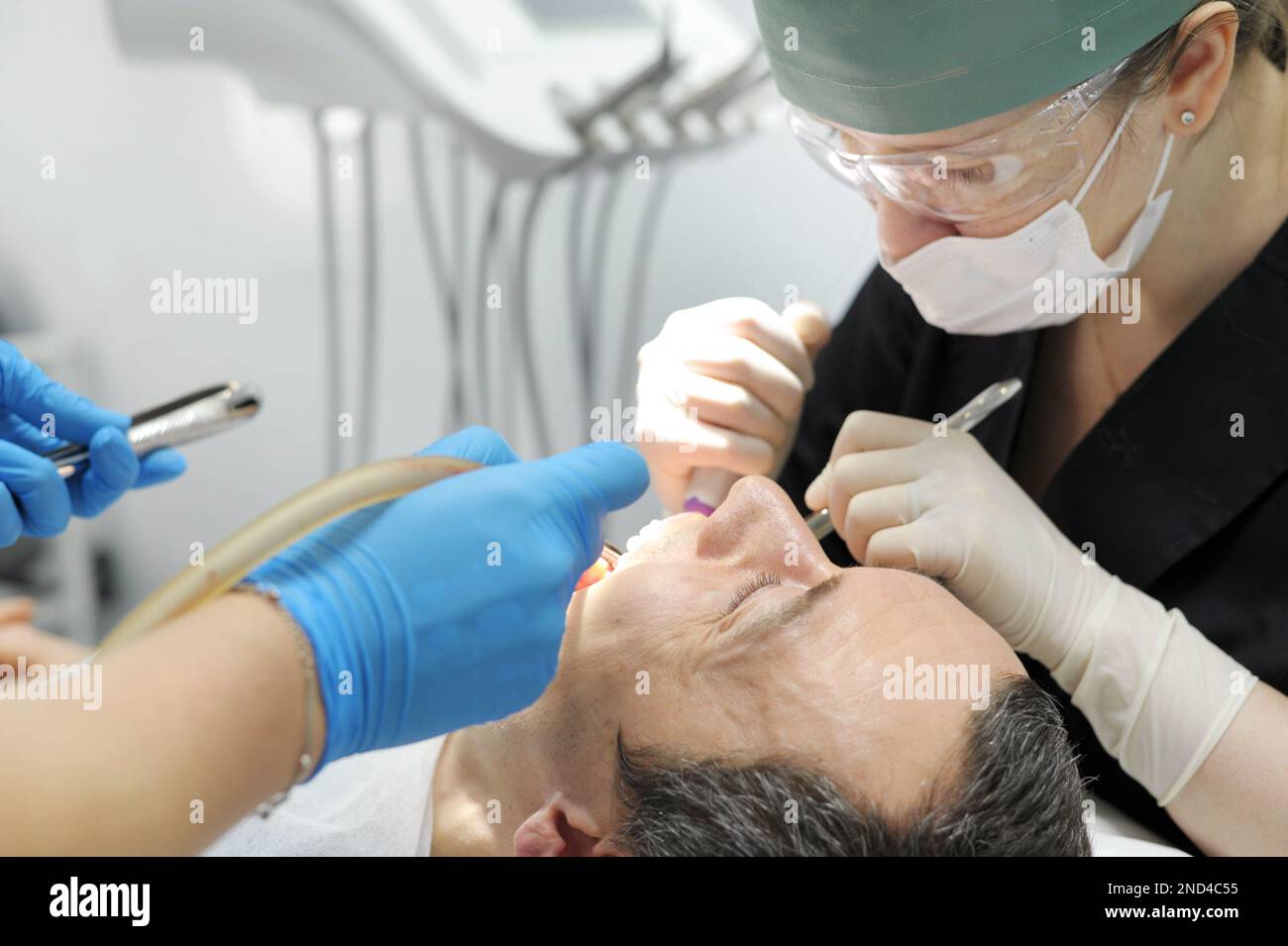 Dentist perform dental implantation operation hi-res stock photography ...