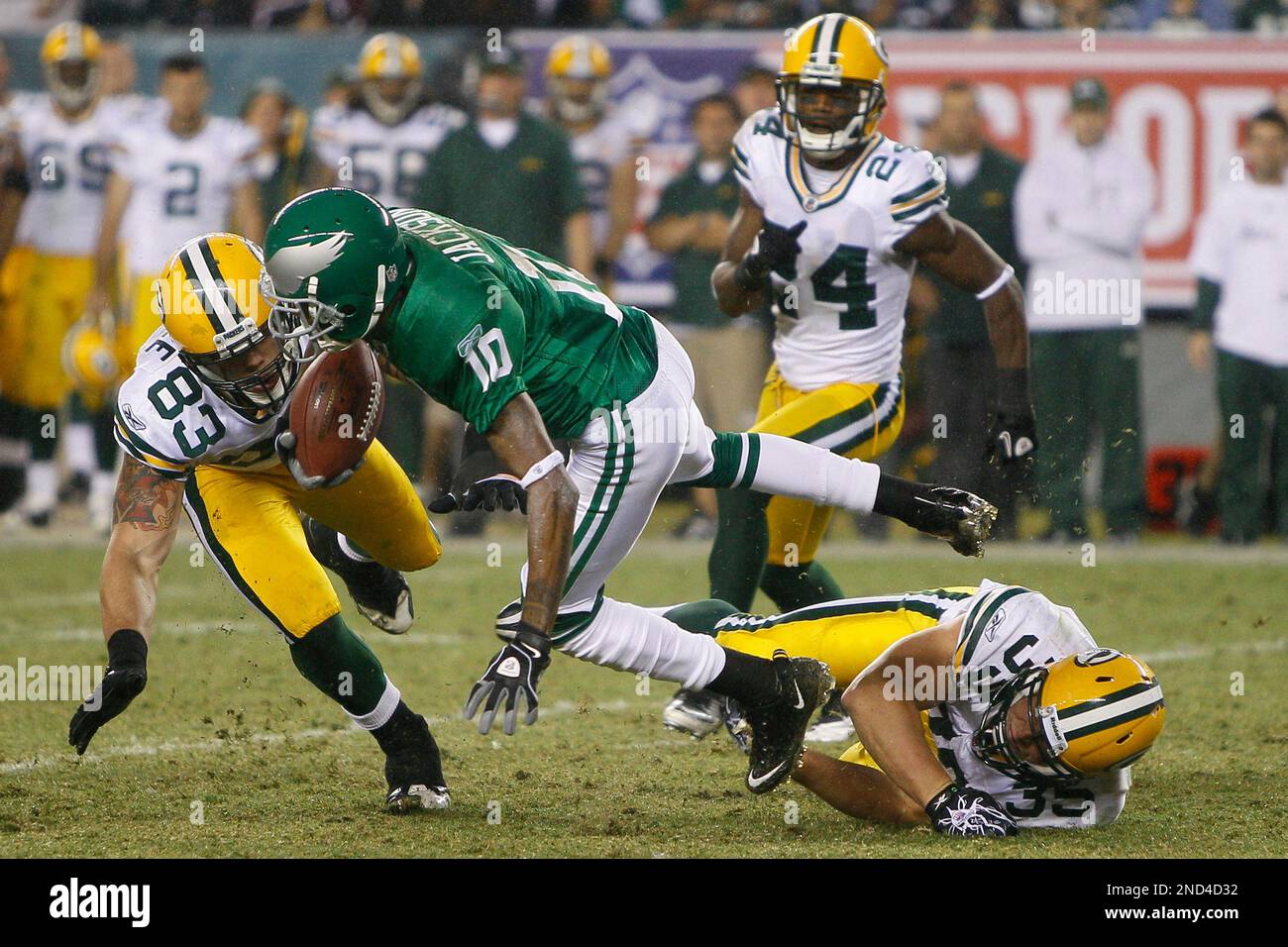 Philadelphia Eagles' DeSean Jackson, center, is tackled by Green